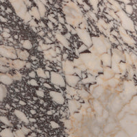 Close-up of Calacatta Viola marble showcasing unique patterns and rich texture.