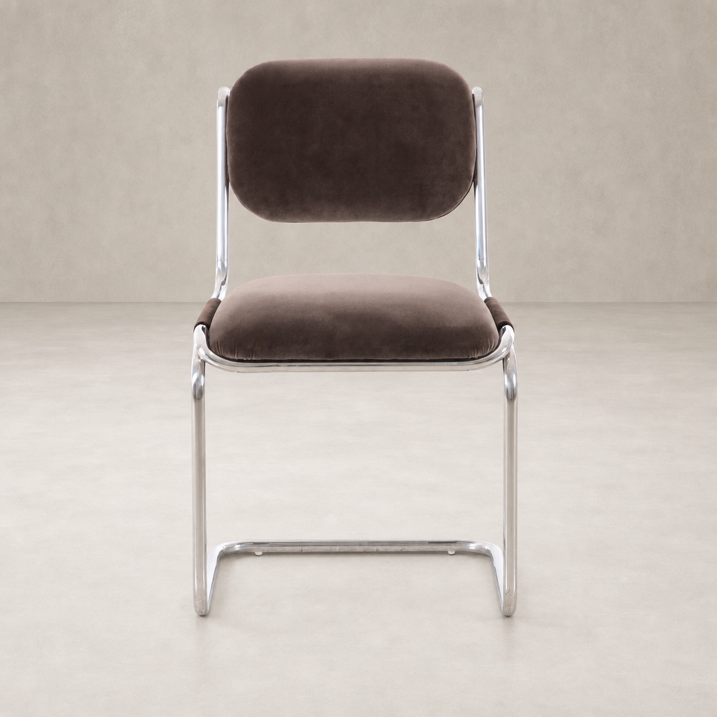 Surrey Mink dining chair with a sleek metal frame and plush upholstery.