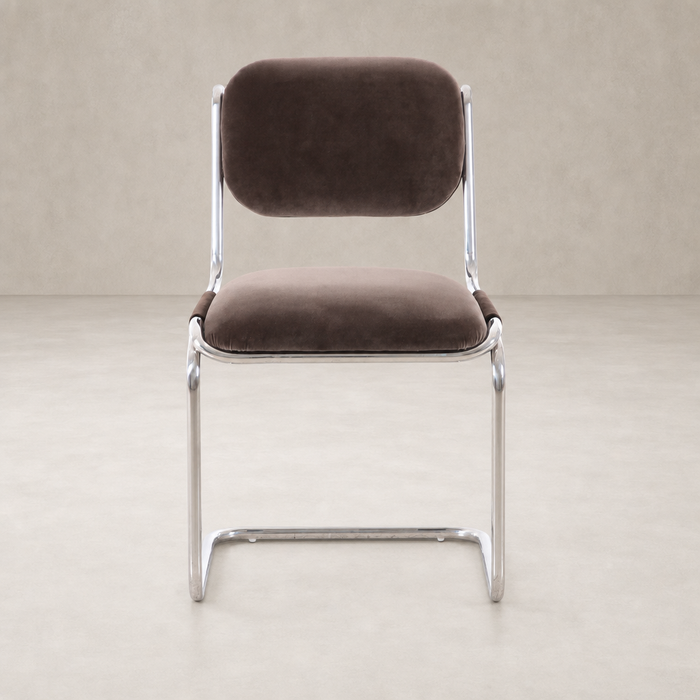 Surrey Mink dining chair with a sleek metal frame and plush upholstery.