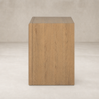 Sandy oak nightstand featuring a sleek, minimalist design and smooth finish.