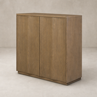 Felix Small Cabinet in drifted oak featuring smooth, rounded edges and a sleek design.