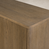 Felix Small Cabinet in drifted oak featuring a smooth, rounded top and wood grain texture.