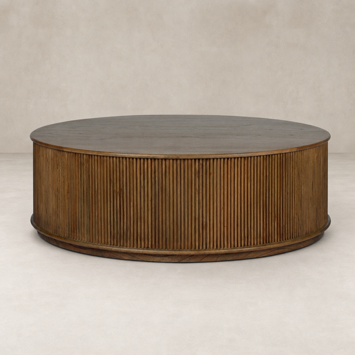 Ola Coffee Table in Amber Mindi with ribbed detailing and smooth circular top.