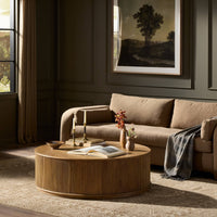 Ola Coffee Table in Amber Mindi, featuring a round design with ribbed detailing.