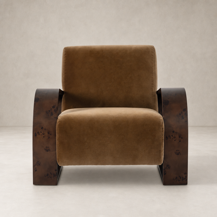 Orchid Chair in Surrey Ochre featuring plush upholstery and distinctive wooden arms.