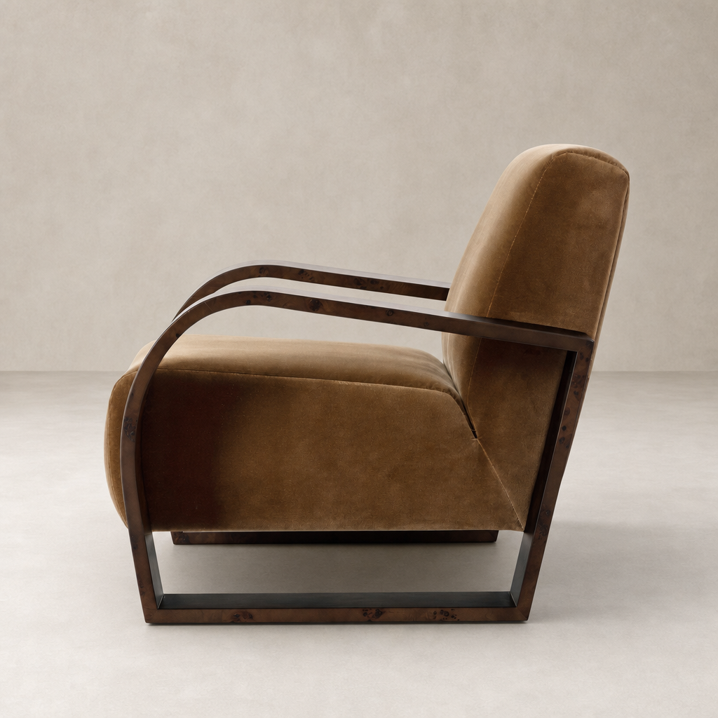 Side view of Orchid Chair in Surrey Ochre with curved wood arms and plush upholstery.
