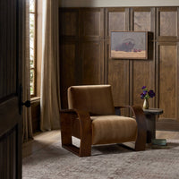 Orchid Chair in Surrey Ochre with wooden arms, set in a warm, inviting room.