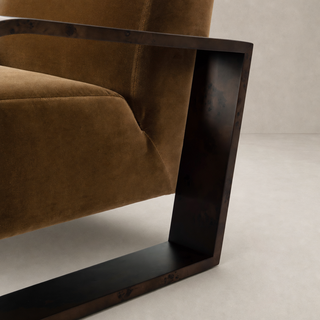 Orchid Chair in Surrey Ochre featuring a sleek metal frame and plush velvet upholstery.