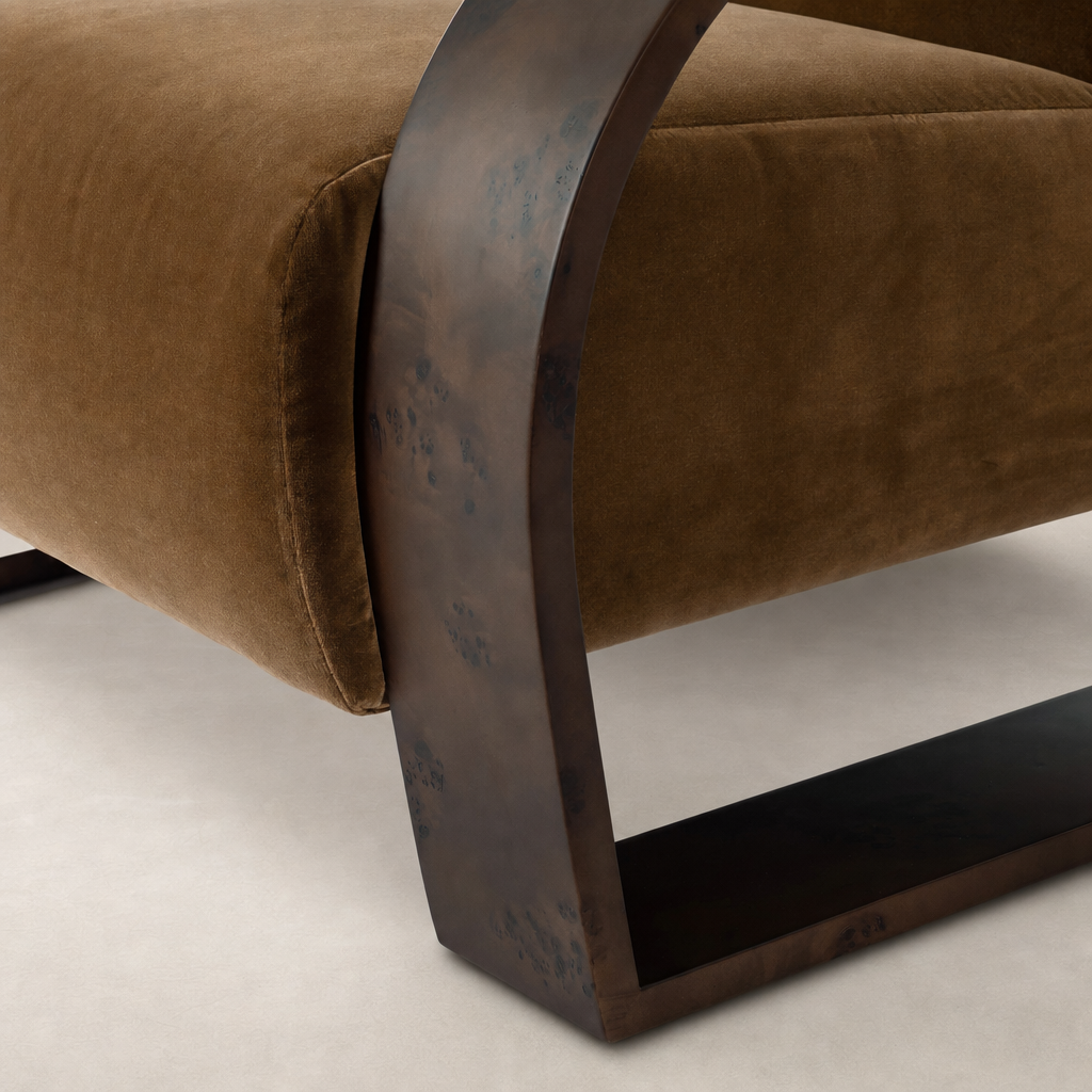 Orchid Chair in Surrey Ochre with sleek curved metal legs and plush upholstery.