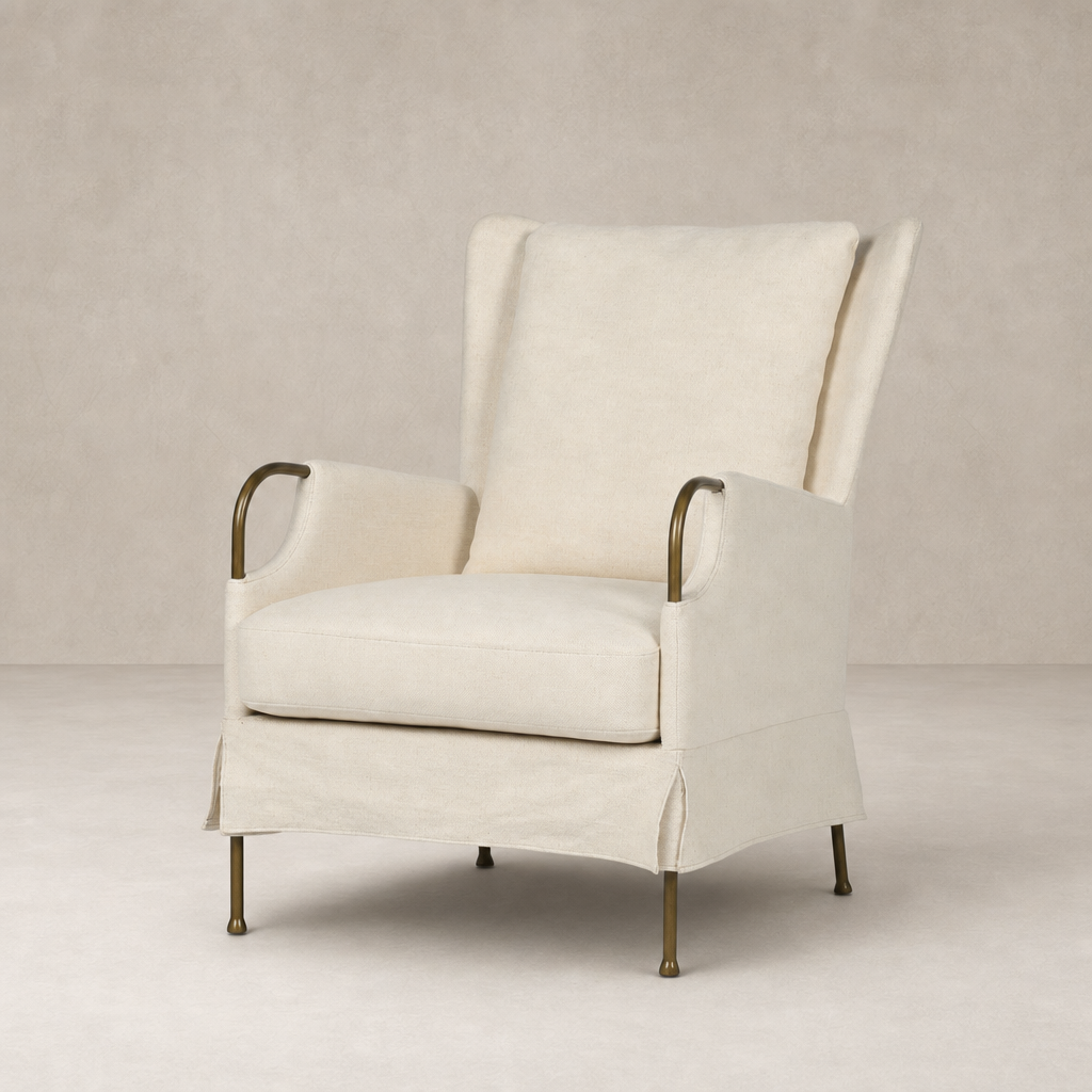 Ada Chair in Bergamo Parchment with elegant curved arms and brass legs.