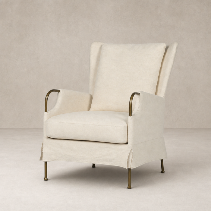 Ada Chair in Bergamo Parchment with elegant curved arms and brass legs.