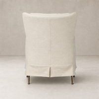 Ada Chair in Bergamo Parchment featuring a smooth, rounded back and elegant legs.