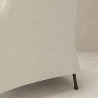 Ada Chair in Bergamo Parchment showcasing soft fabric texture and elegant leg design.