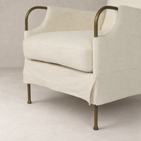 Ada Chair in Bergamo Parchment featuring a soft fabric and sleek metal legs.