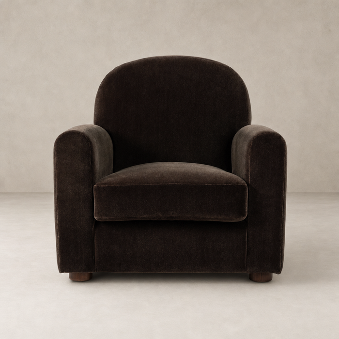 Chiara Chair in Monte Chocolate, featuring rounded arms and plush upholstery.