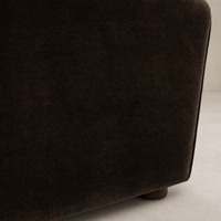 Chiara Chair in Monte Chocolate showing soft, plush velvet texture and rounded edges.