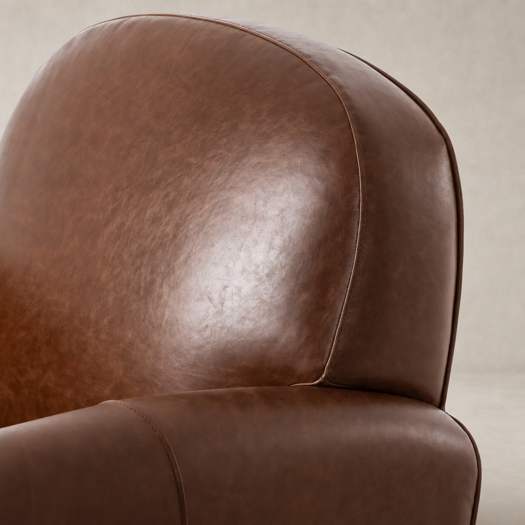 Close-up of the Chiara Chair in Dulane Mahogany showcasing its smooth leather texture.