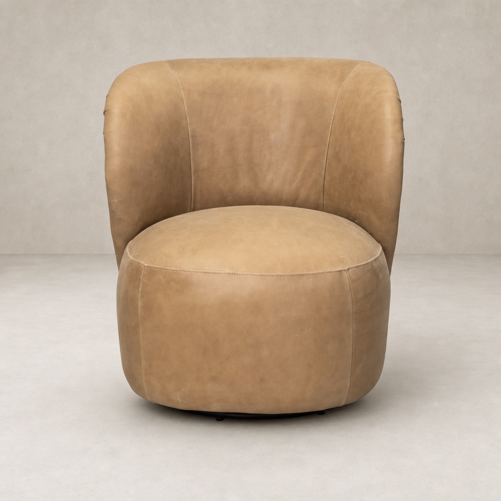 Misha Swivel Chair in Palermo Drift features a rounded design with soft leather texture.