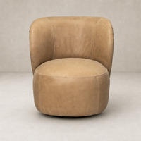 Misha Swivel Chair in Palermo Drift features a rounded design with soft leather texture.