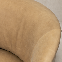 Close-up of the Misha Swivel Chair in Palermo Drift showcasing its soft texture and elegant curves.