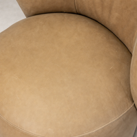 Misha Swivel Chair in Palermo Drift showcasing smooth, luxurious leather texture.