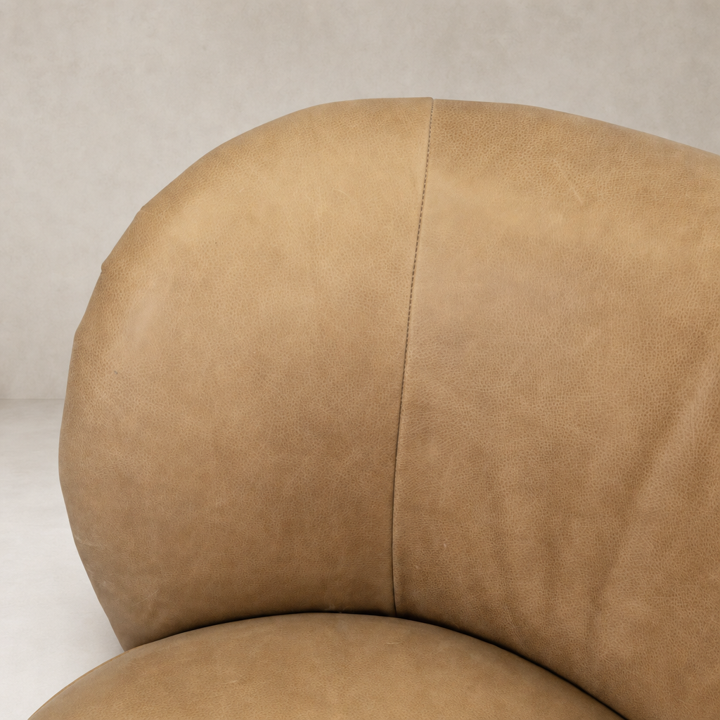 Close-up of Misha Swivel Chair in Palermo Drift, showcasing its soft leather texture.