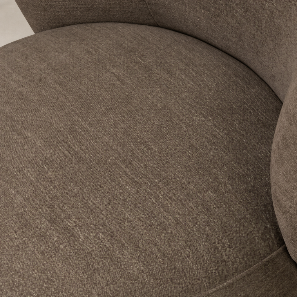 Close-up of Misha Swivel Chair in Laughlin Cafe showing soft, textured upholstery.