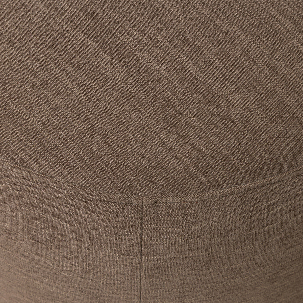 Close-up of Misha Swivel Chair in Laughlin Cafe textured fabric.