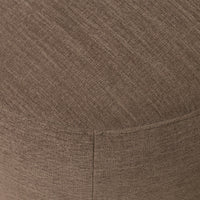 Close-up of Misha Swivel Chair in Laughlin Cafe textured fabric.