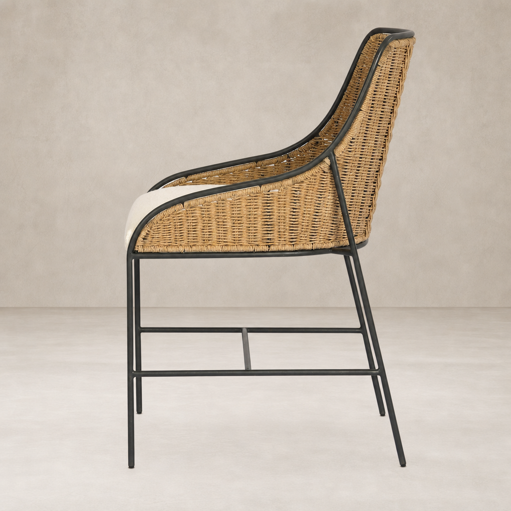 Side view of Savile Flax dining chair with woven rattan seat and black metal frame.