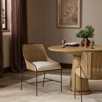 Savile Flax dining chair featuring woven rattan backrest and elegant metal frame.