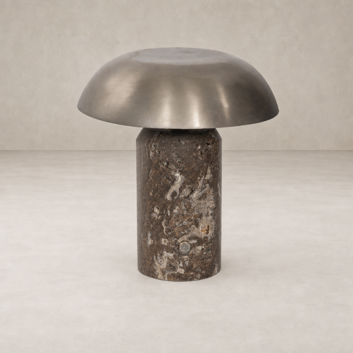 Cordless table lamp with an antique nickel shade and textured base.
