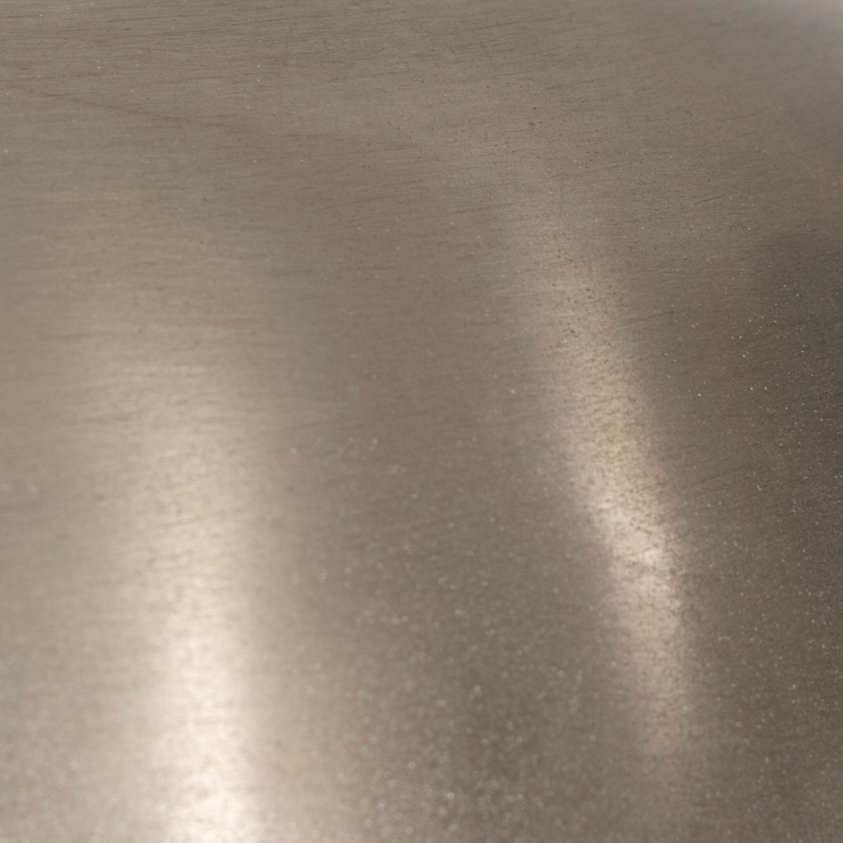 Close-up of a cordless table lamp showcasing its antique nickel finish and texture.