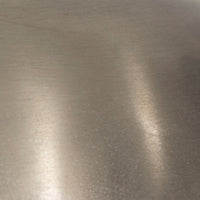 Close-up of a cordless table lamp showcasing its antique nickel finish and texture.