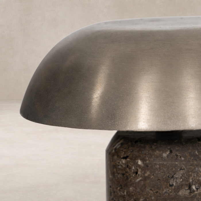 Cordless table lamp with antique nickel finish and sleek rounded shade.