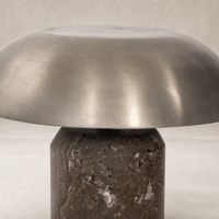 Cordless table lamp in antique nickel finish with a polished dome shade.