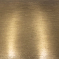 Detailed close-up of aged antique brass iron surface on a cordless table lamp.