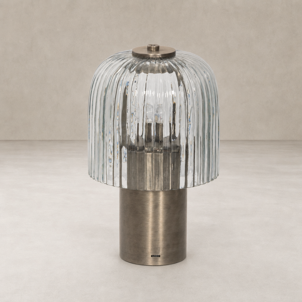 Cordless table lamp in antique nickel with a ribbed glass shade.