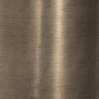 Close-up of the brushed surface of an antique nickel cordless table lamp.