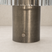Antique nickel cordless table lamp base with textured finish and subtle on/off switch.