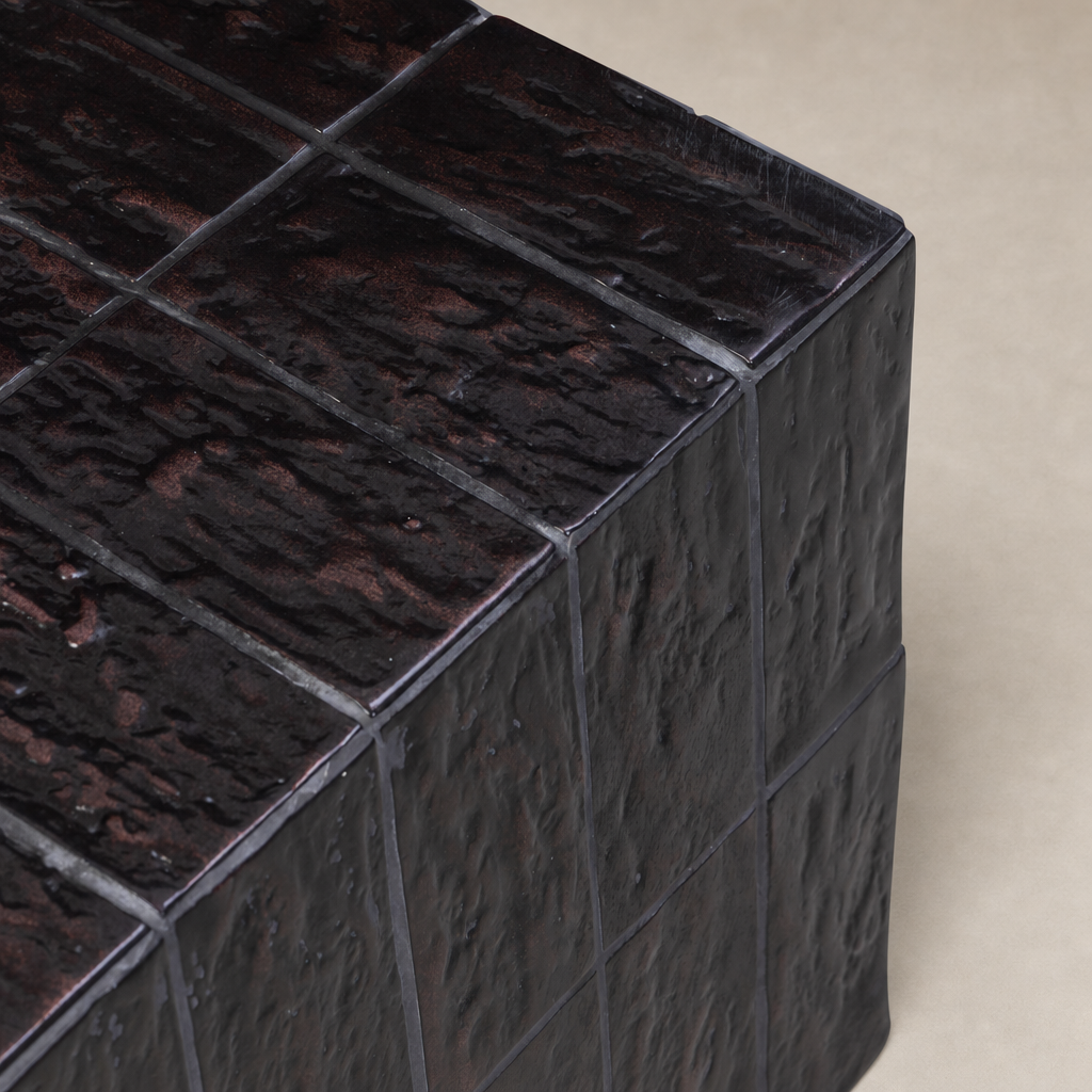 Textured brown tile end table with a unique, rugged surface design.