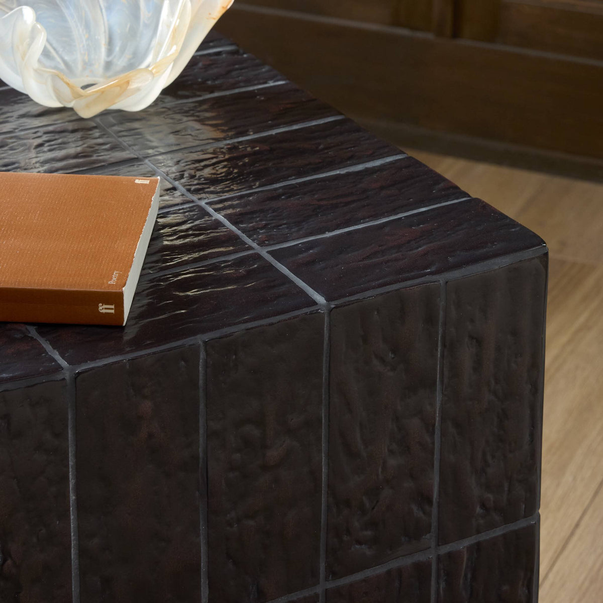 Textured brown tile end table showcasing a sleek, modern design with a glossy finish.