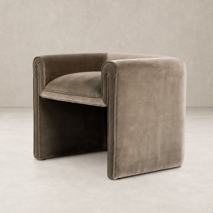 Surrey Fossil accent stool with plush upholstery and modern curved design.