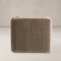 Surrey Fossil accent stool with a smooth, rounded design and plush upholstery.