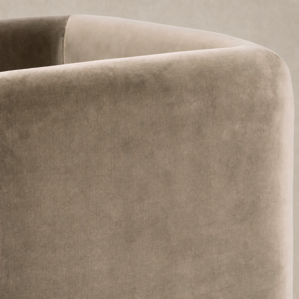 Soft Surrey Fossil accent stool featuring a sleek, rounded design and plush texture.