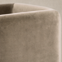 Soft Surrey Fossil accent stool featuring a sleek, rounded design and plush texture.