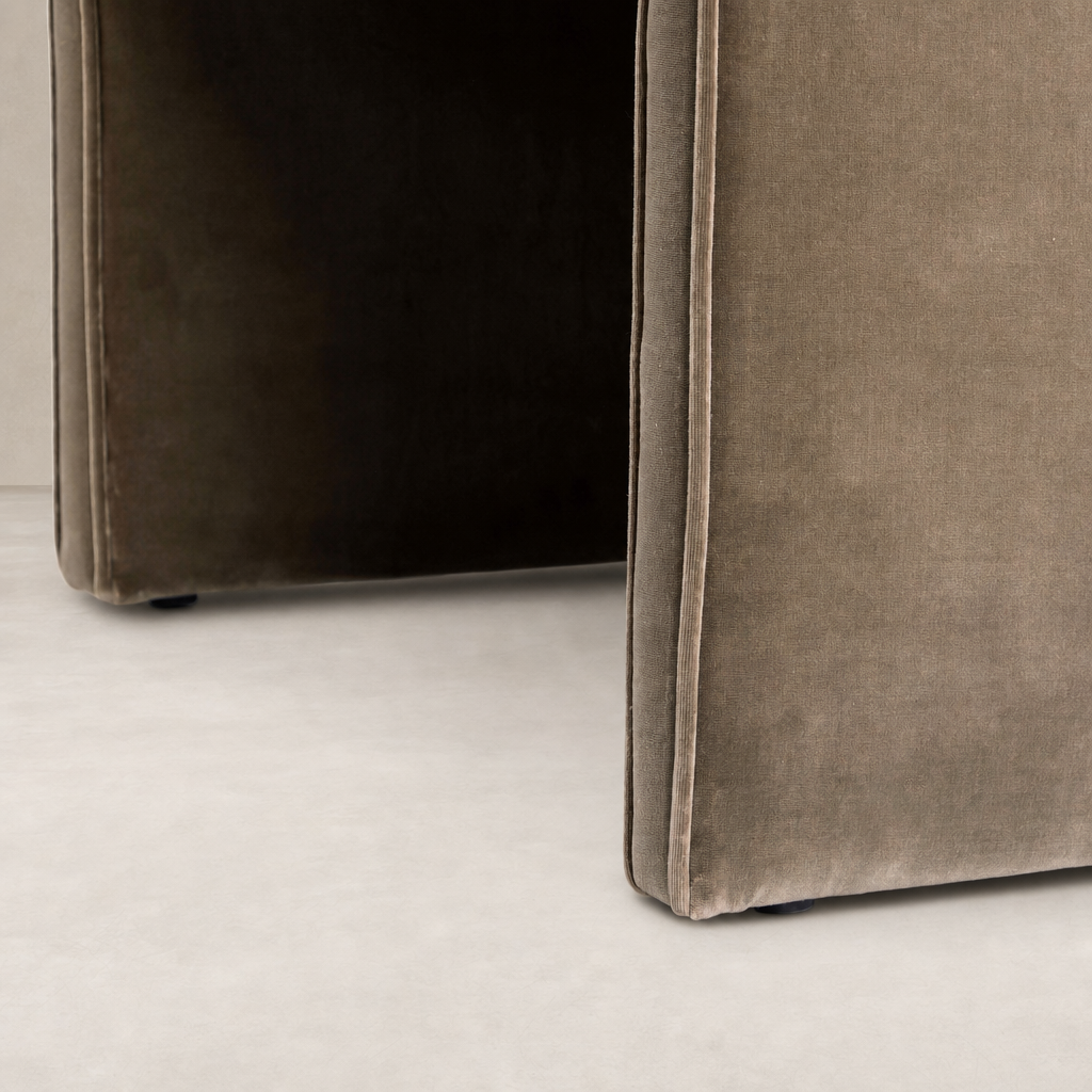 Surrey Fossil accent stool featuring a sleek design and soft fabric texture.