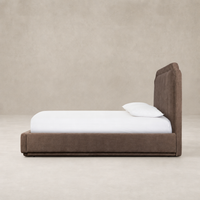 Modern bed in Laughlin Cafe upholstery with plush headboard and sleek frame.