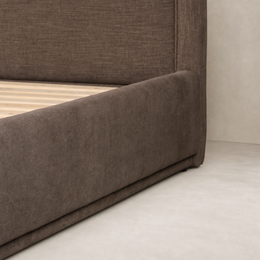 Contemporary bed in Laughlin Cafe color with plush upholstery and sleek lines.