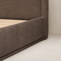 Contemporary bed in Laughlin Cafe color with plush upholstery and sleek lines.